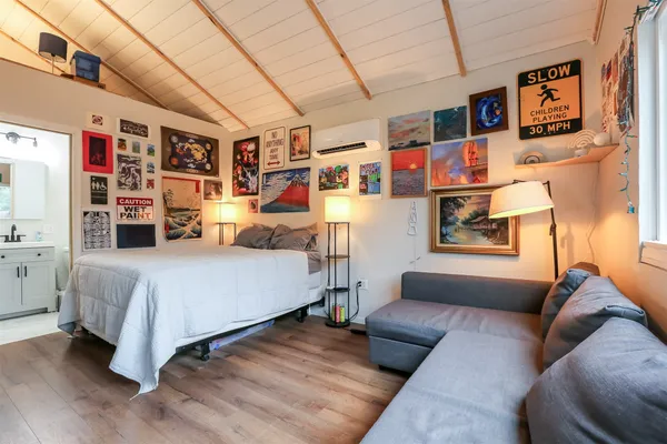 a bedroom with furniture and a couch