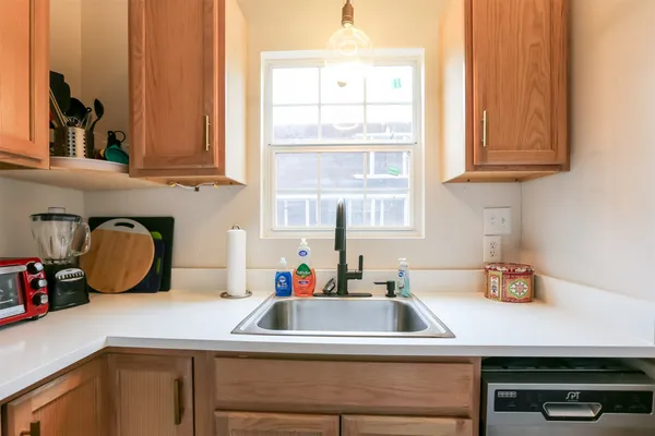 a kitchen with a sink and a window