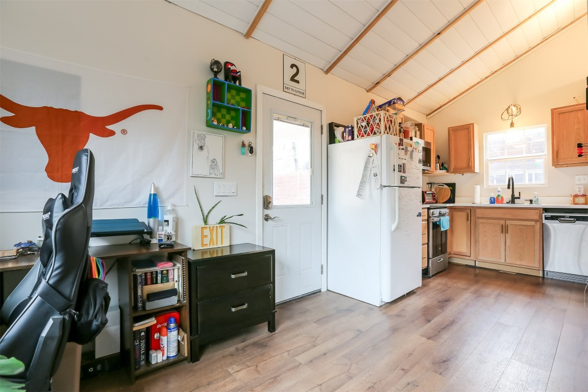 308 East 32nd Street, Unit B Austin, TX 78705 - Photo 10 of 27 a view of walk in closet with clothes and shoes