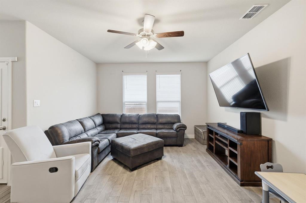 1420 Pleasanton Road Cleburne, TX 76033 - Photo 15 of 39 a living room with furniture and a flat screen tv