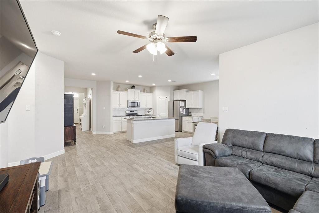 1420 Pleasanton Road Cleburne, TX 76033 - Photo 18 of 39 a living room with furniture and kitchen view