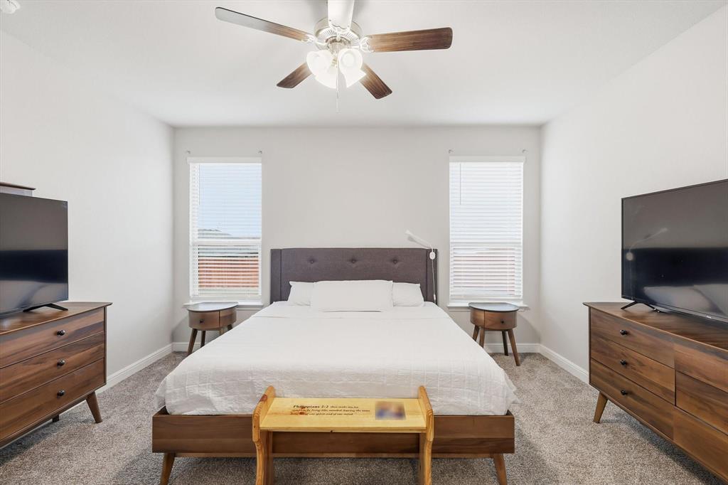 1420 Pleasanton Road Cleburne, TX 76033 - Photo 21 of 39 a bedroom with a bed and a flat screen tv