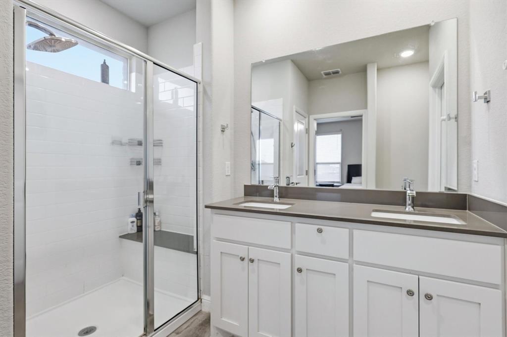 1420 Pleasanton Road Cleburne, TX 76033 - Photo 24 of 39 a bathroom with a granite countertop sink mirror and double