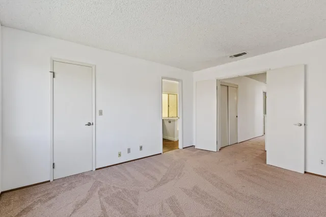 a view of a kitchen from the hallway