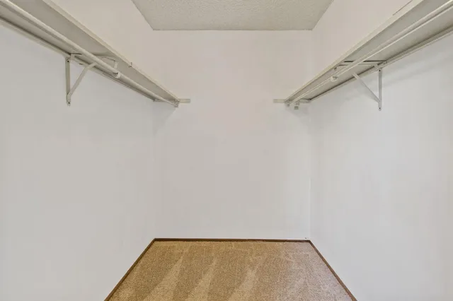 a bathroom with a sink vanity and a toilet