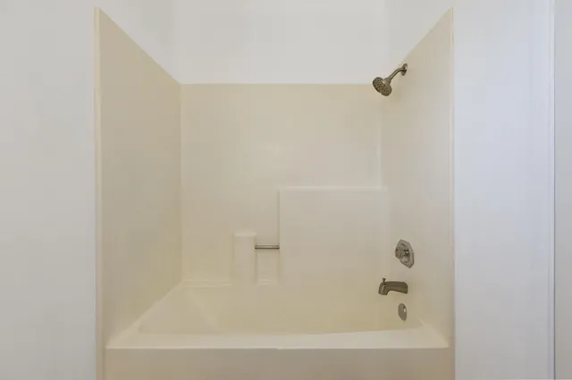 a view of a backyard with tree