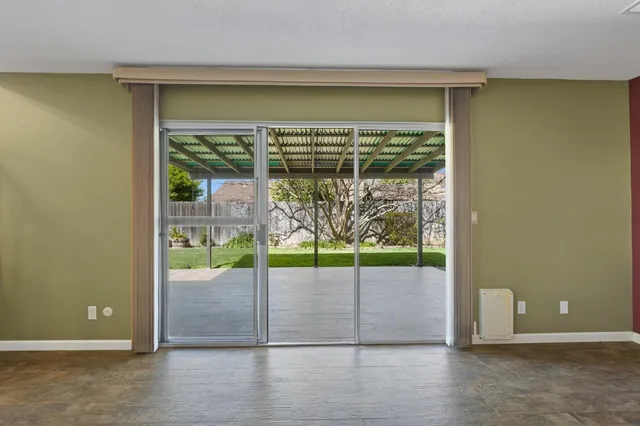 an aerial view of residential houses with outdoor space and street view