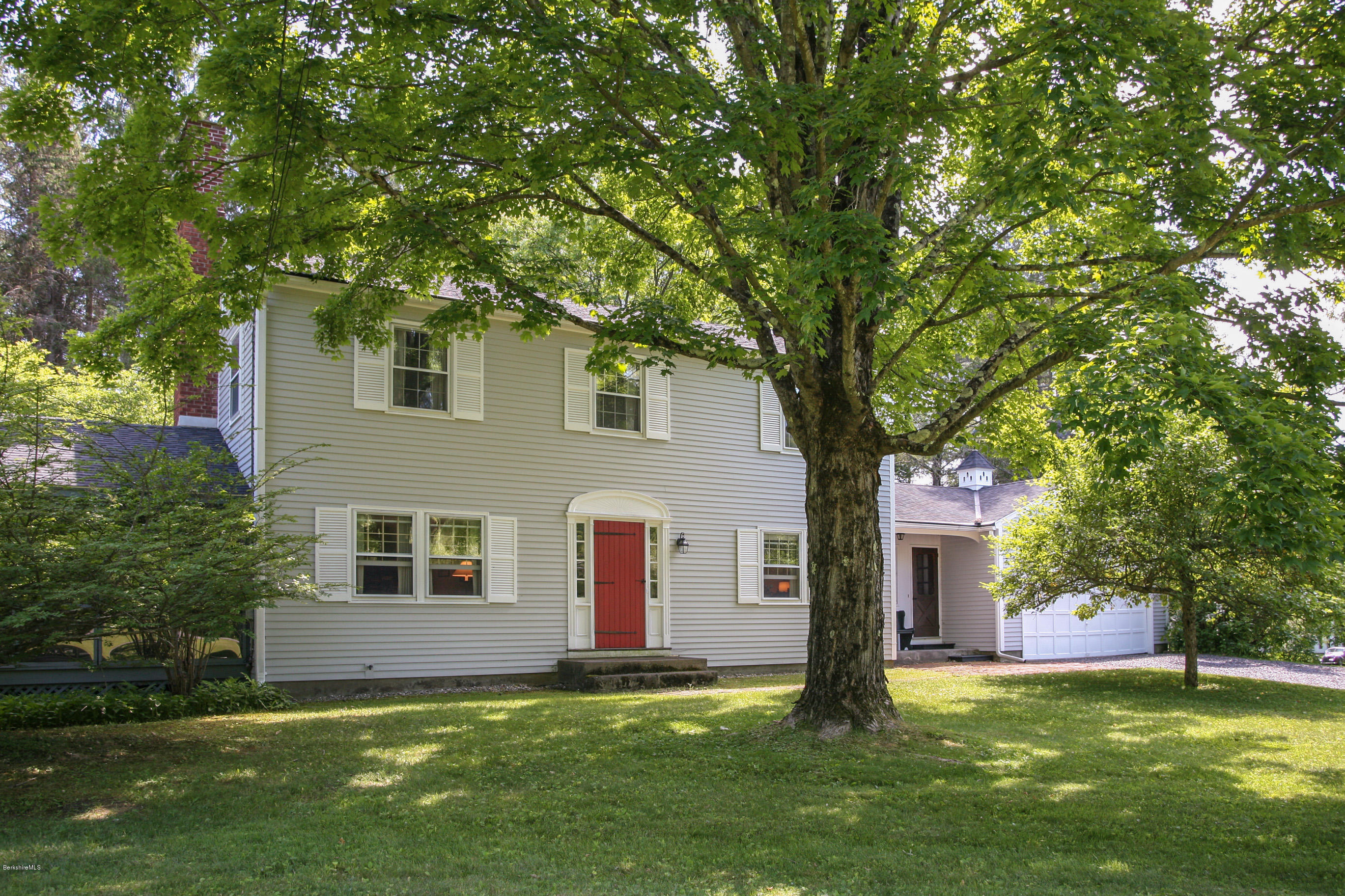 6 Interlaken Cross Road Stockbridge, MA 01262 - Photo 1 of 20 a front view of a house with a garden