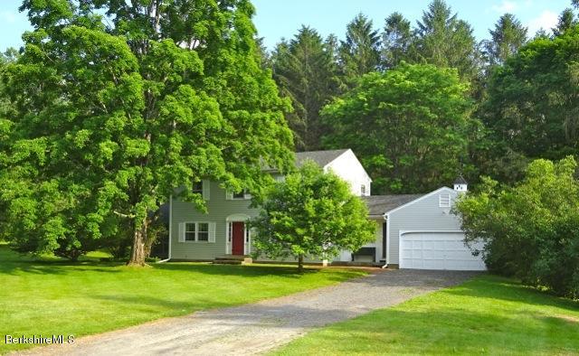 6 Interlaken Cross Road Stockbridge, MA 01262 - Photo 2 of 20 a backyard of a house with plants and large trees