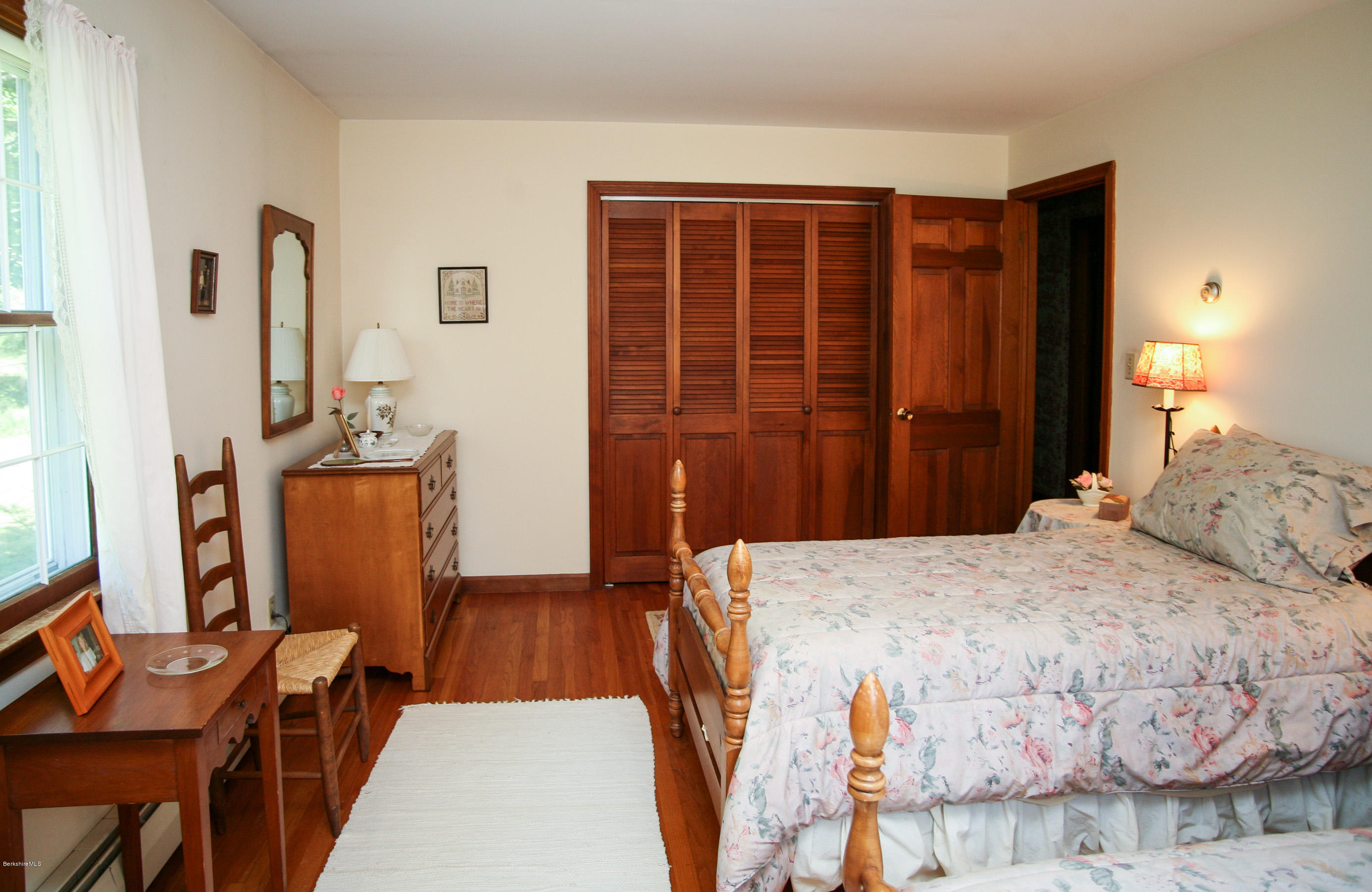 6 Interlaken Cross Road Stockbridge, MA 01262 - Photo 12 of 20 a bedroom with a bed and wooden floor