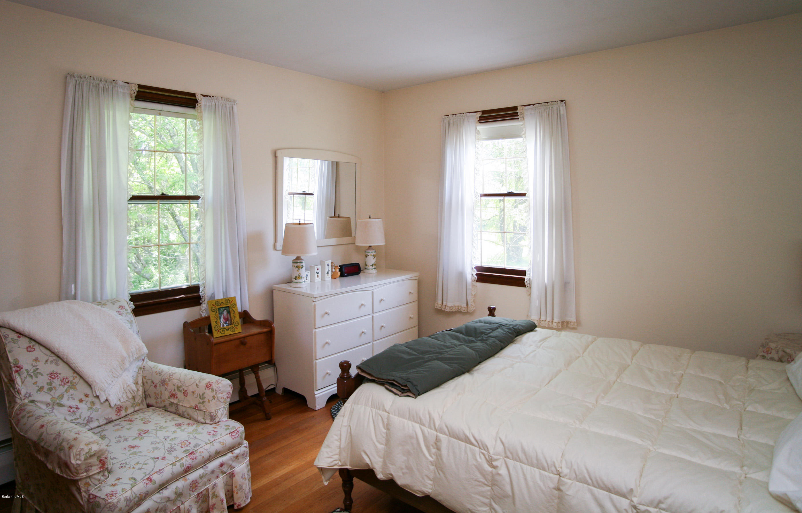 6 Interlaken Cross Road Stockbridge, MA 01262 - Photo 16 of 20 a bedroom with a bed and wooden floor