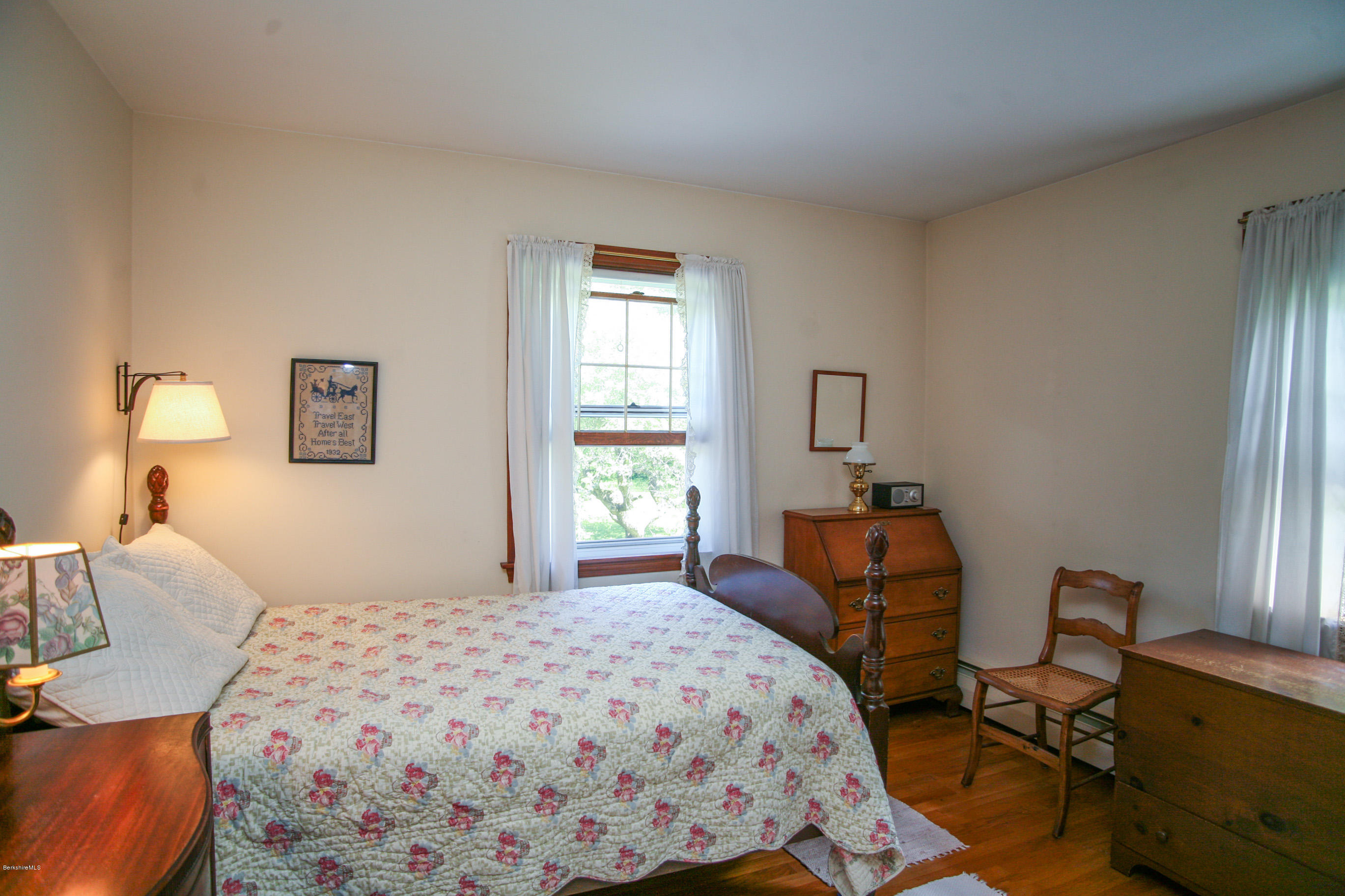 6 Interlaken Cross Road Stockbridge, MA 01262 - Photo 17 of 20 a bedroom with a bed and wooden floor