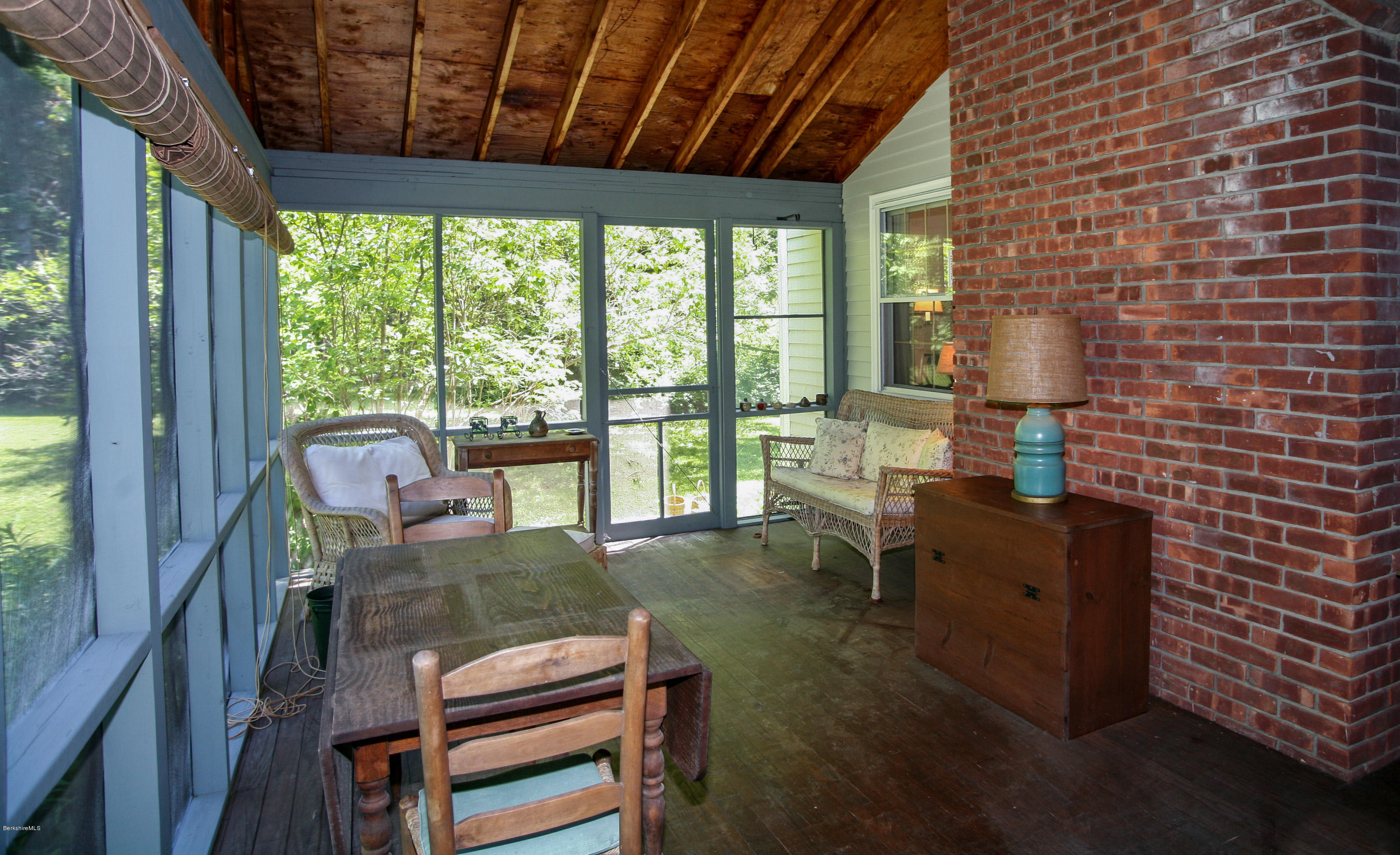 6 Interlaken Cross Road Stockbridge, MA 01262 - Photo 18 of 20 a living room with furniture and a floor to ceiling window