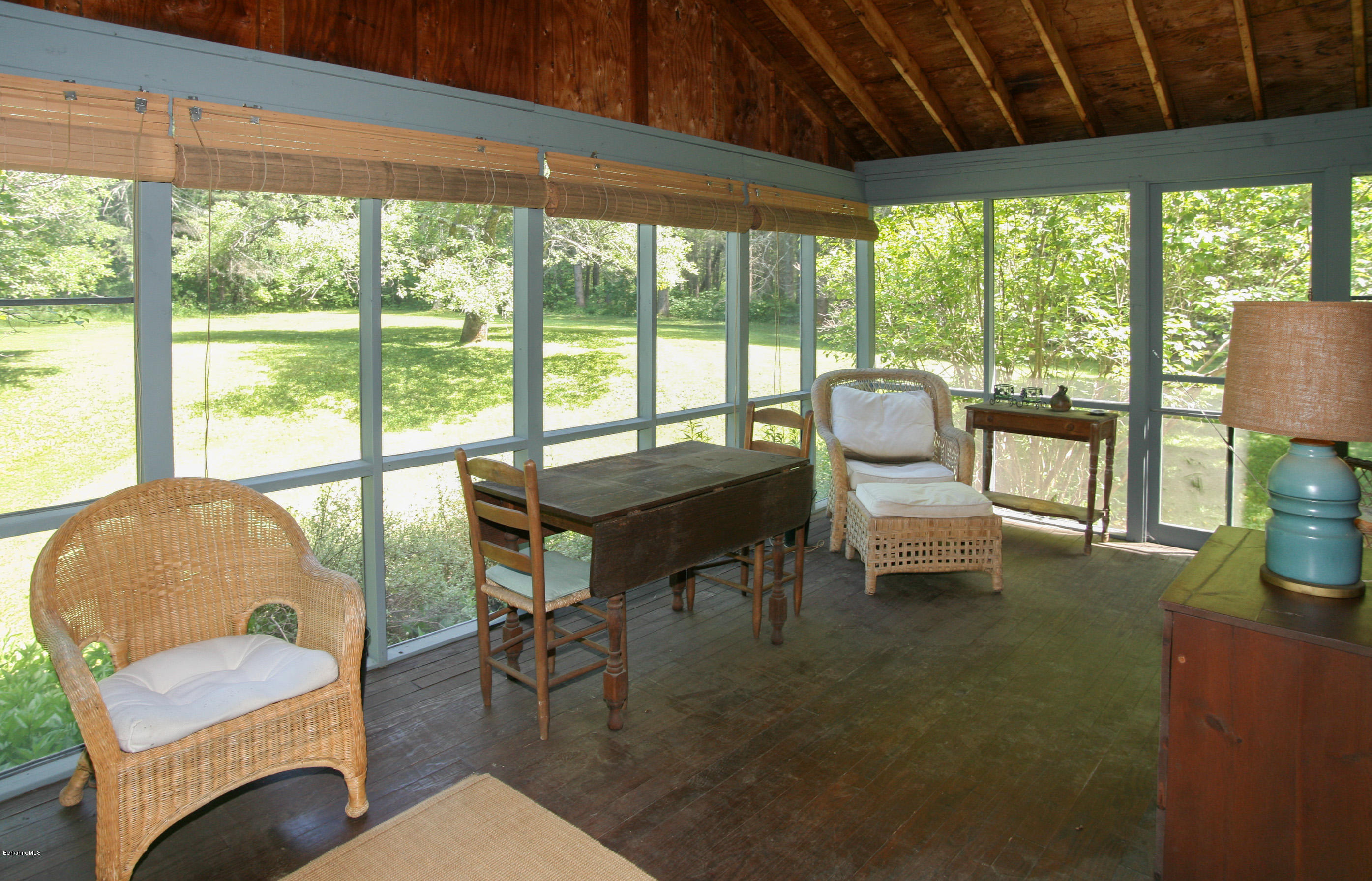 6 Interlaken Cross Road Stockbridge, MA 01262 - Photo 20 of 20 a living room with furniture and a floor to ceiling window