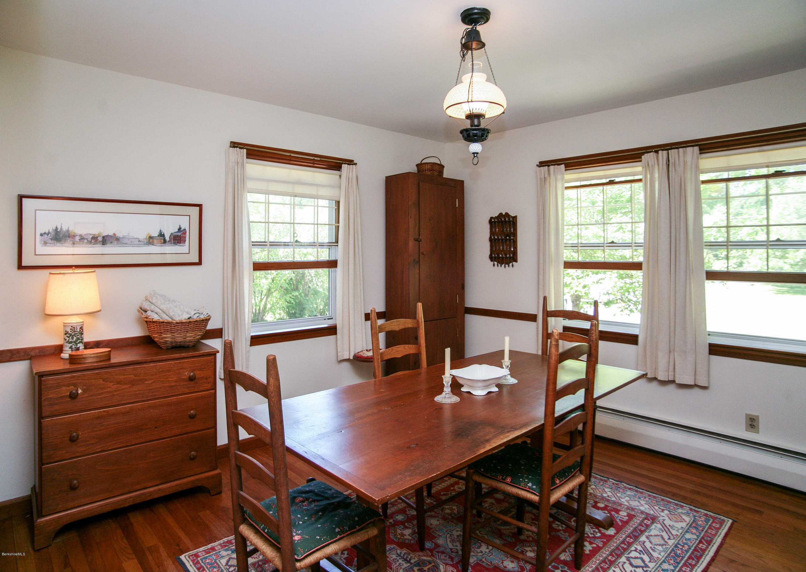 6 Interlaken Cross Road Stockbridge, MA 01262 - Photo 3 of 20 a view of a dining room with furniture window and wooden floor