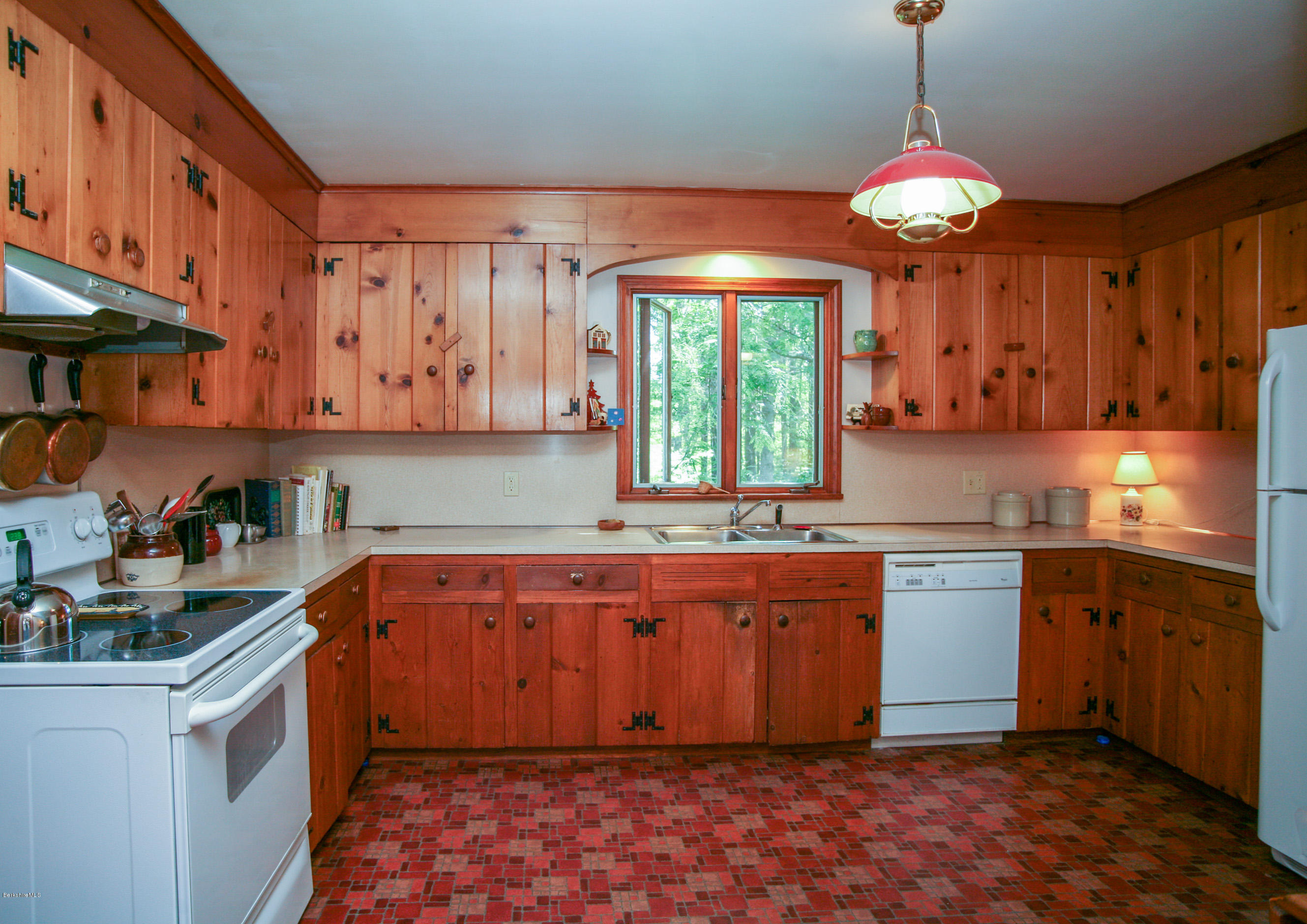 6 Interlaken Cross Road Stockbridge, MA 01262 - Photo 5 of 20 a kitchen with stainless steel appliances granite countertop a sink a stove and a wooden cabinets