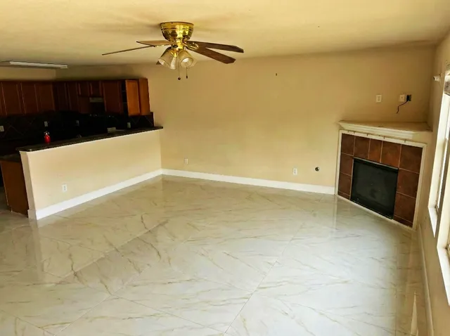 a view of a bathroom with a glass door and a sink