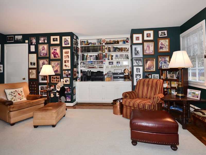 21 Cross Road Darien, CT 06820 - Photo 15 of 25 a living room with furniture and a book shelf