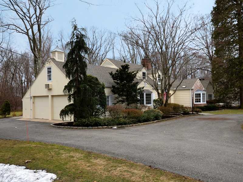 21 Cross Road Darien, CT 06820 - Photo 3 of 25 a view of a house with a snow in front of it