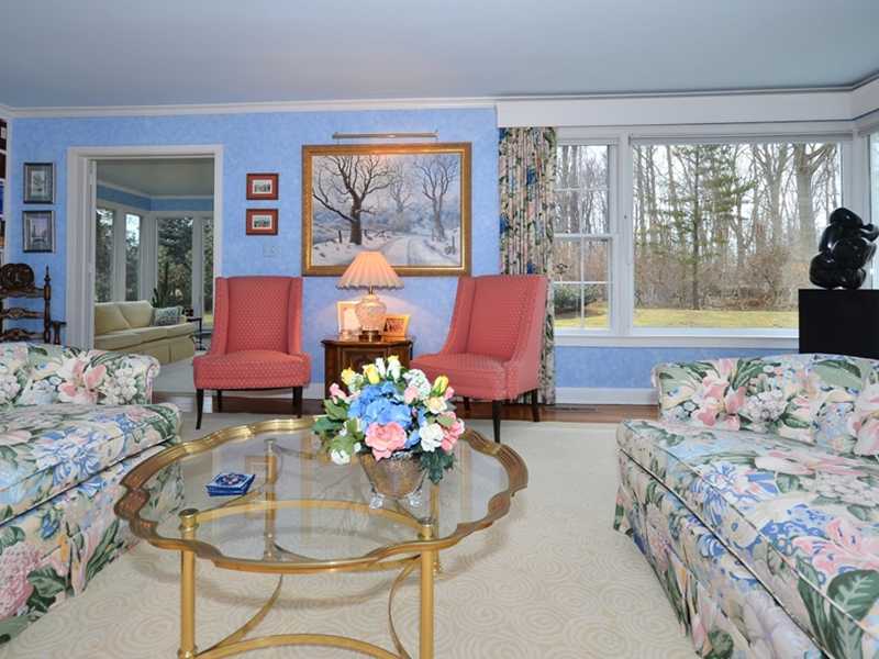21 Cross Road Darien, CT 06820 - Photo 5 of 25 a living room with furniture and large windows