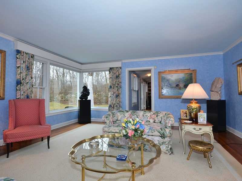 21 Cross Road Darien, CT 06820 - Photo 6 of 25 a living room with furniture and a large window