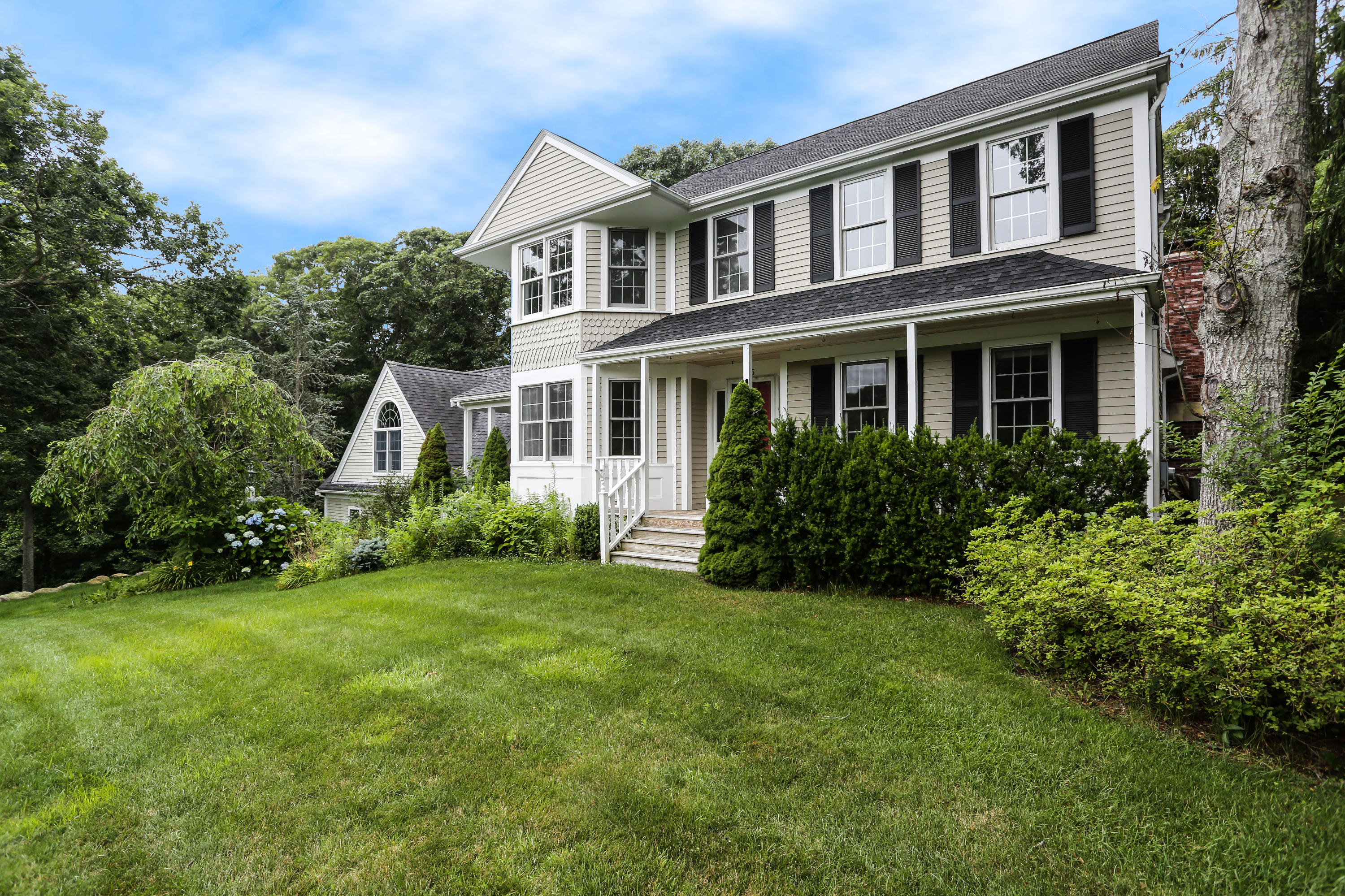 a front view of a house with a yard