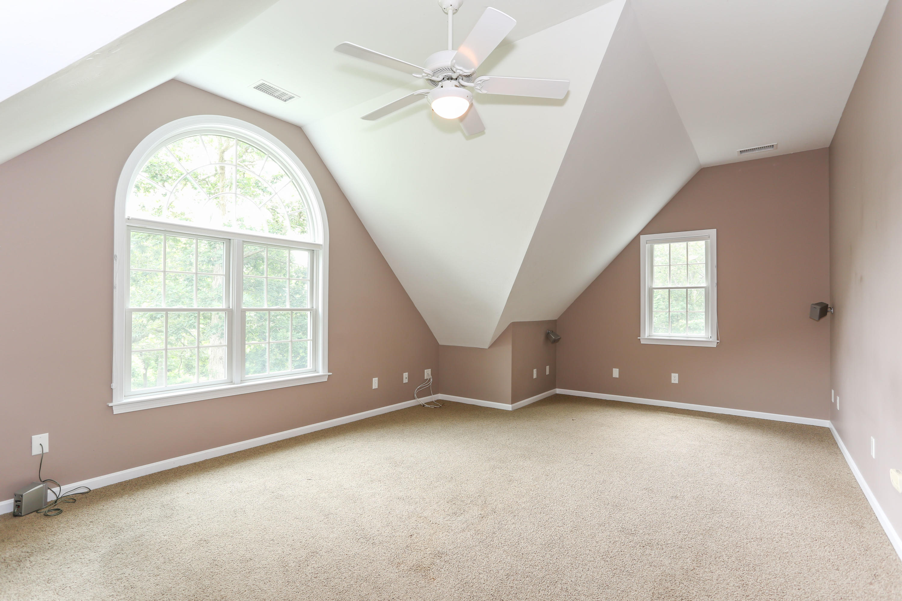 65 Trinity Place Centerville, MA 02632 - Photo 17 of 34 an empty room with windows and fan