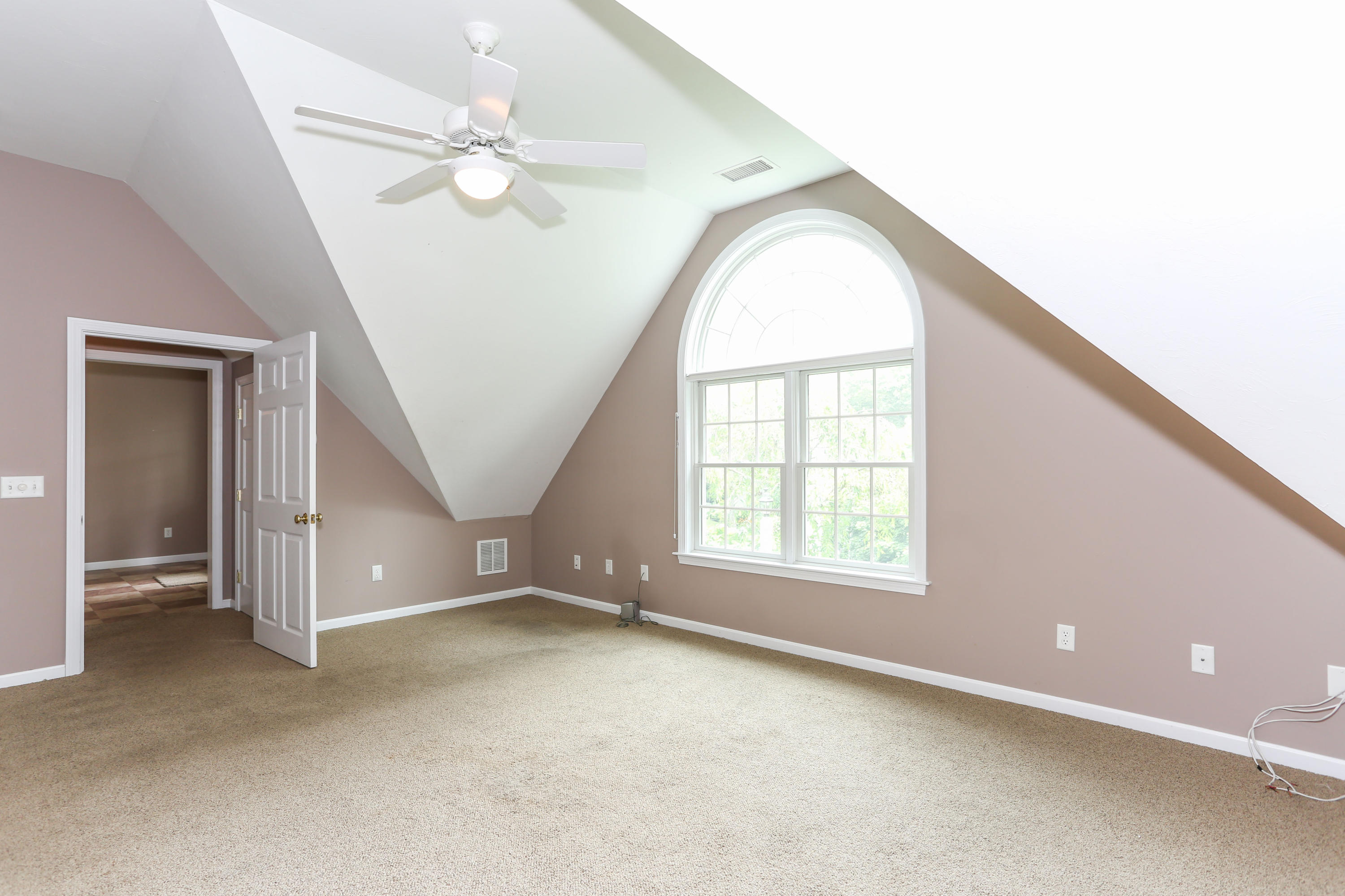 65 Trinity Place Centerville, MA 02632 - Photo 18 of 34 an empty room with windows and ceiling fan
