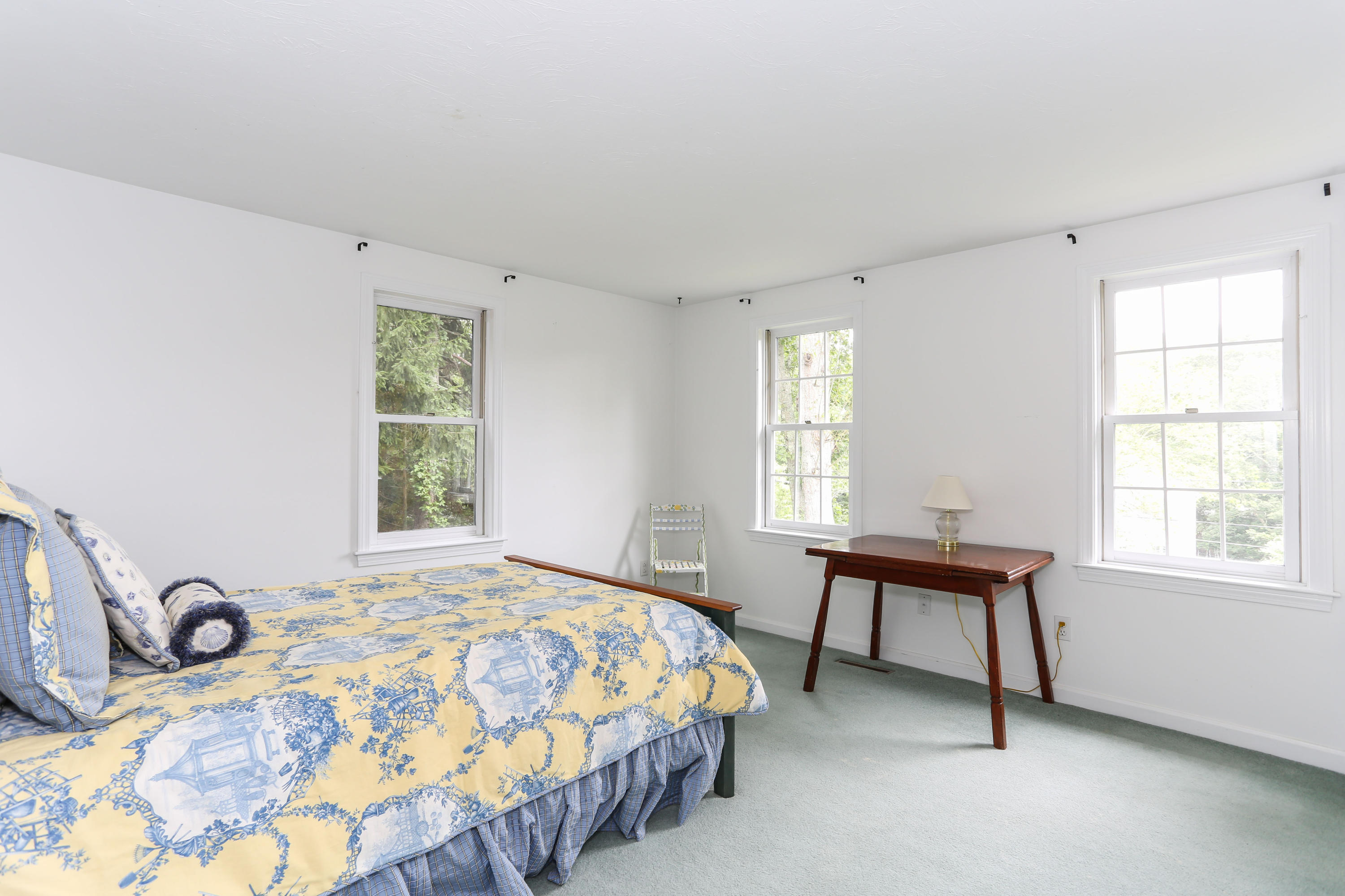 65 Trinity Place Centerville, MA 02632 - Photo 22 of 34 a bedroom with a bed and a window