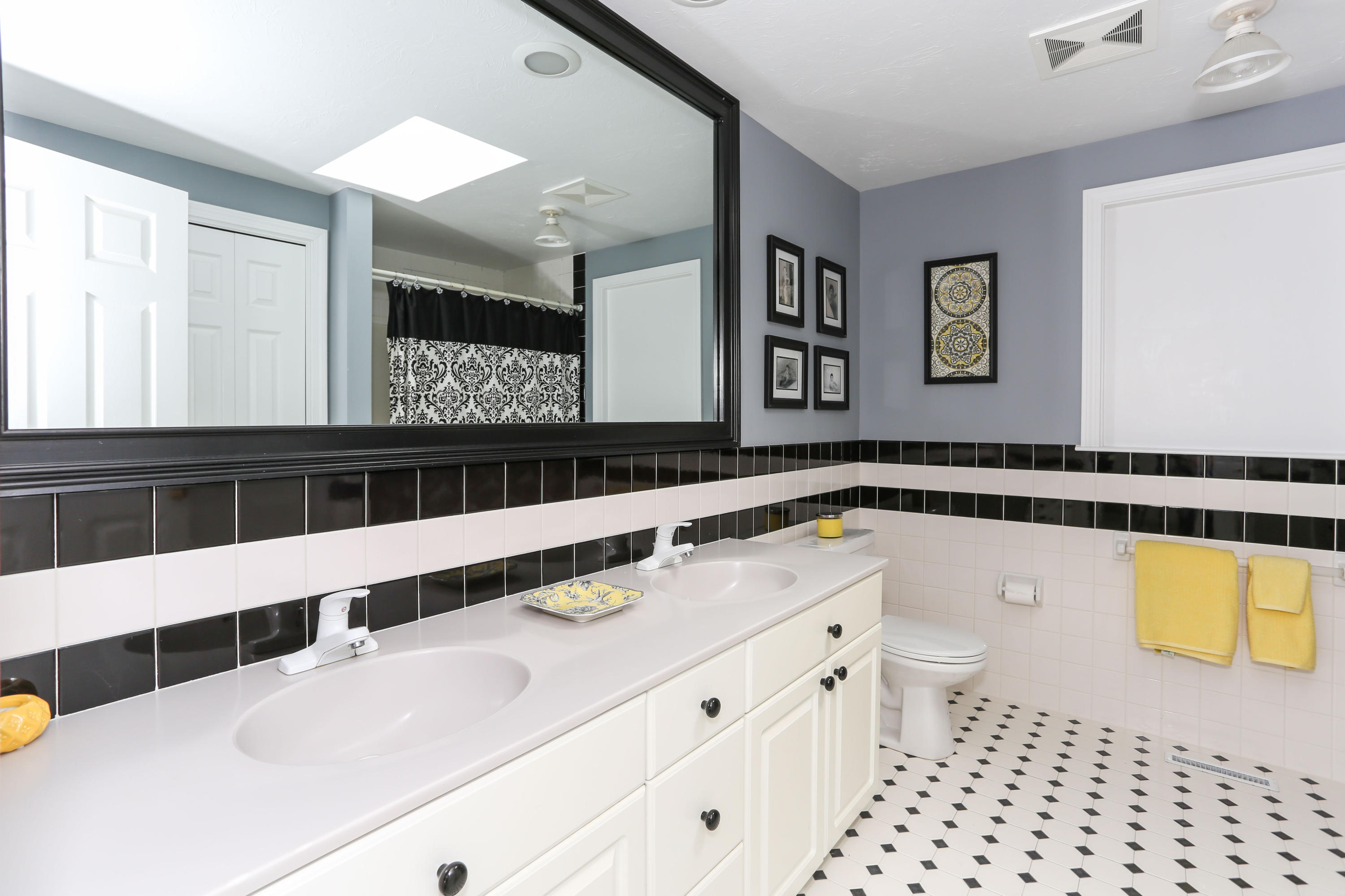 65 Trinity Place Centerville, MA 02632 - Photo 30 of 34 a bathroom with a sink a large mirror and a bathtub