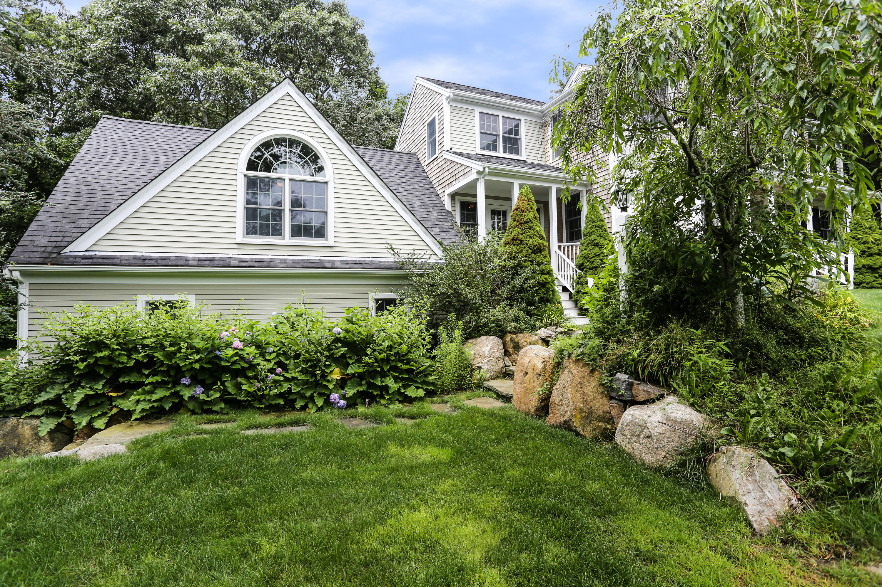 65 Trinity Place Centerville, MA 02632 - Photo 31 of 34 a front view of a house with a garden