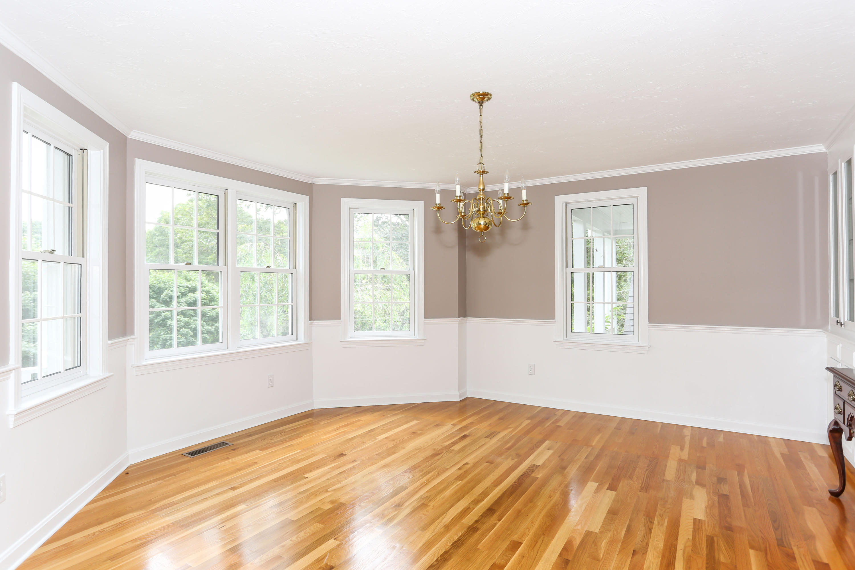 65 Trinity Place Centerville, MA 02632 - Photo 6 of 34 a view of empty room with wooden floor and fan