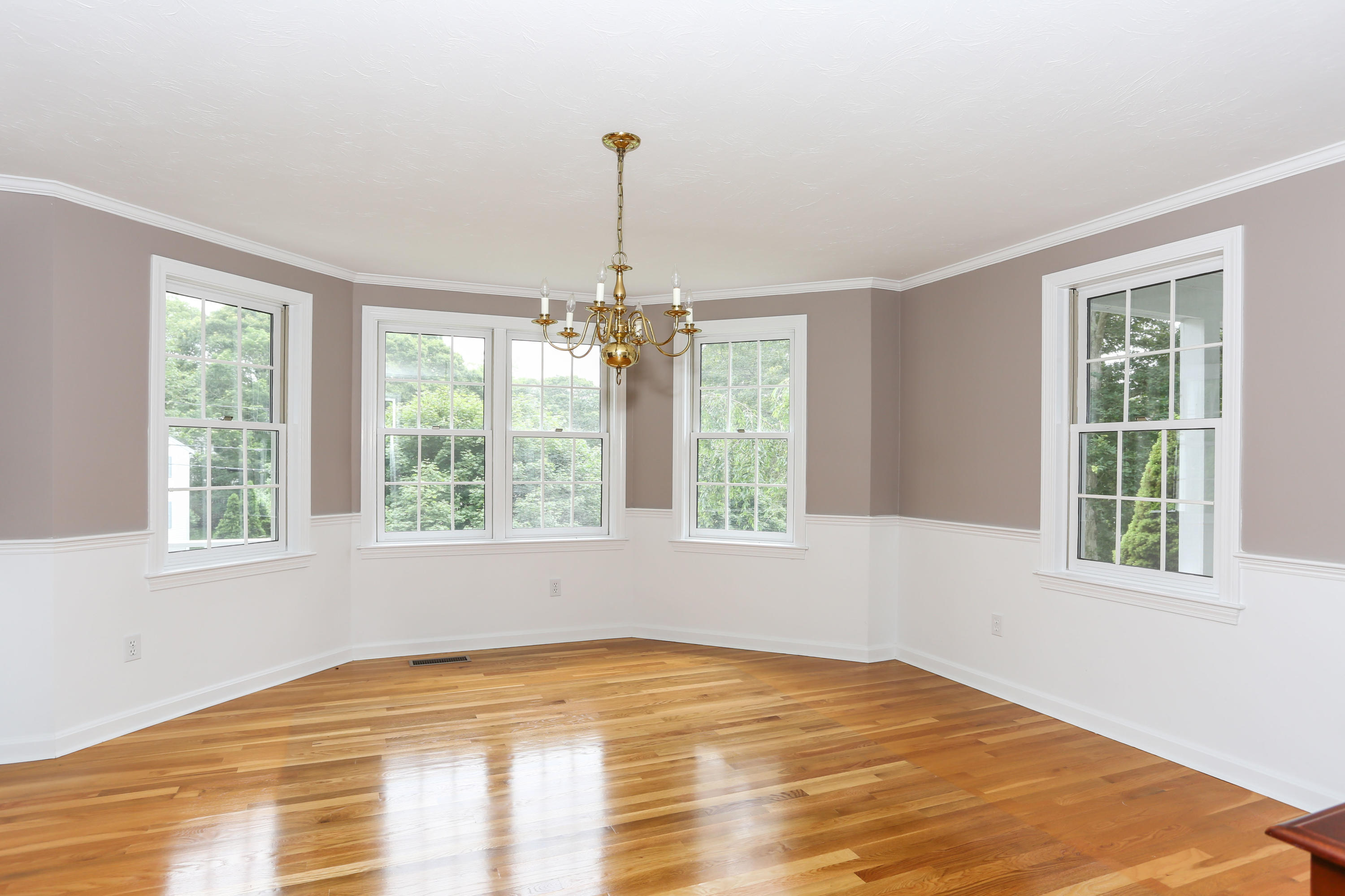 65 Trinity Place Centerville, MA 02632 - Photo 7 of 34 a view of an empty room with a window