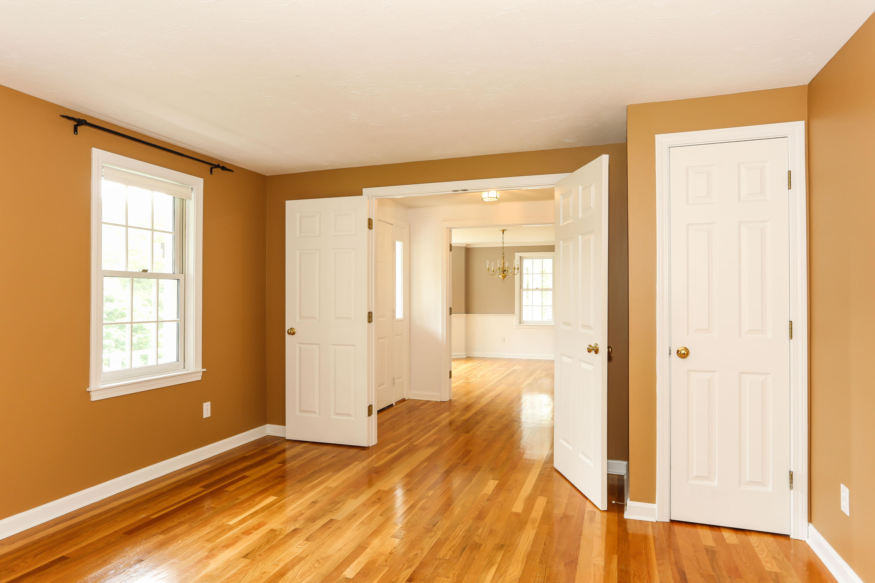 65 Trinity Place Centerville, MA 02632 - Photo 9 of 34 a view of a room with wooden floor and a bathroom