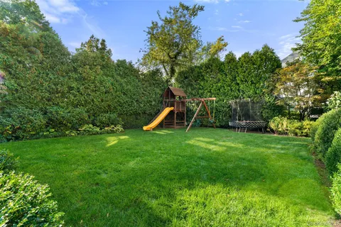 a view of a backyard with a slide