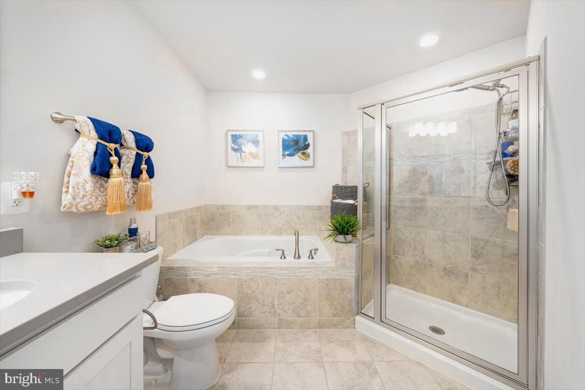 5950 Forum Square Frederick, MD 21703 - Photo 7 of 39 Soaking tub & shower in large primary bathroom