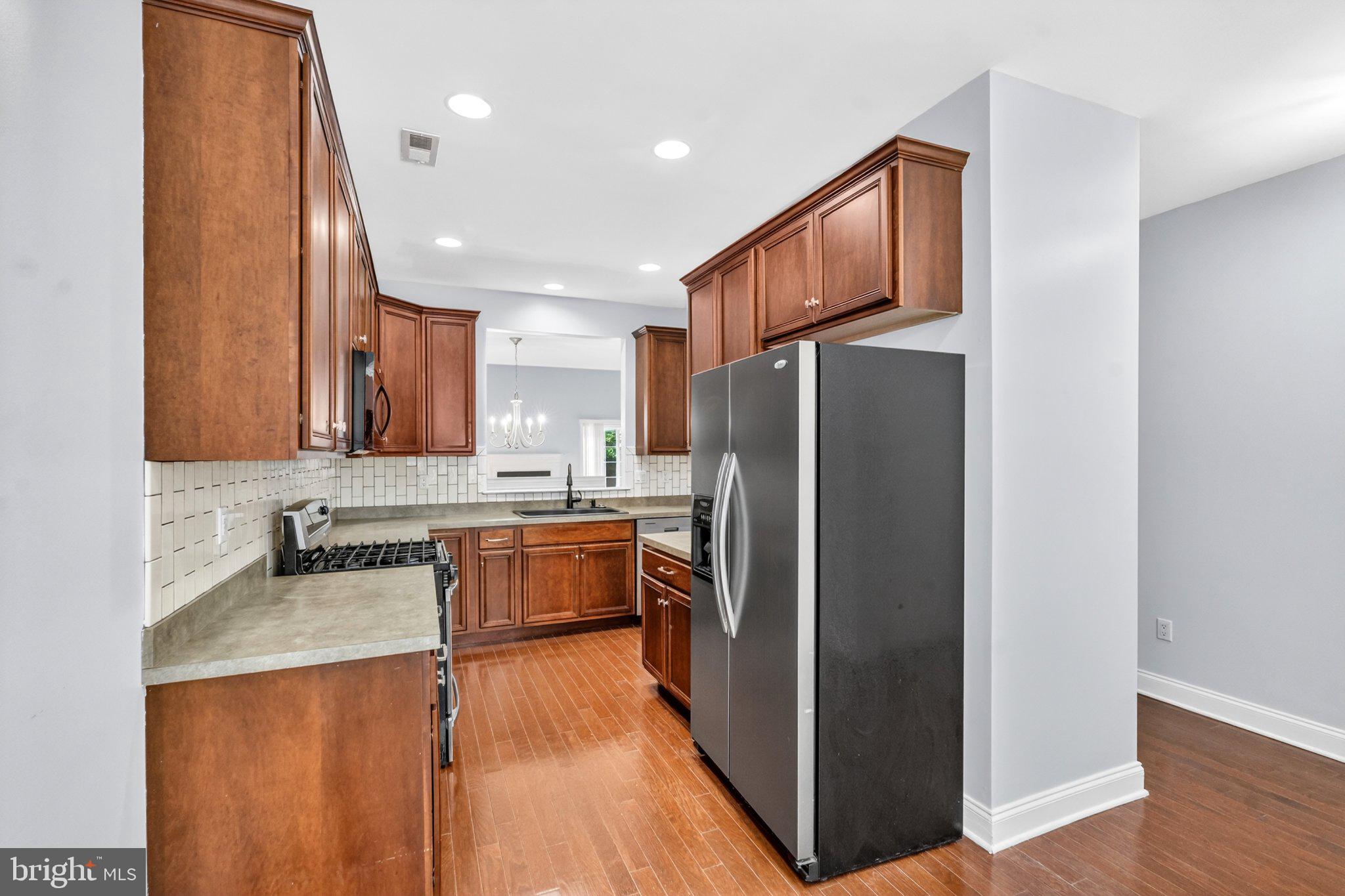 161 Stoyer Road Coatesville, PA 19320 - Photo 5 of 52 Modern kitchen with rich wood accents.