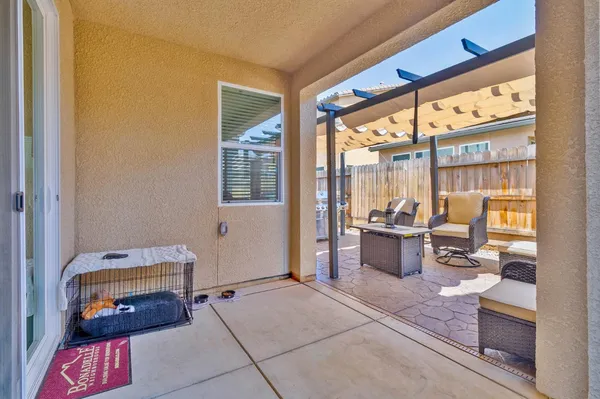 a roof deck with table and chairs