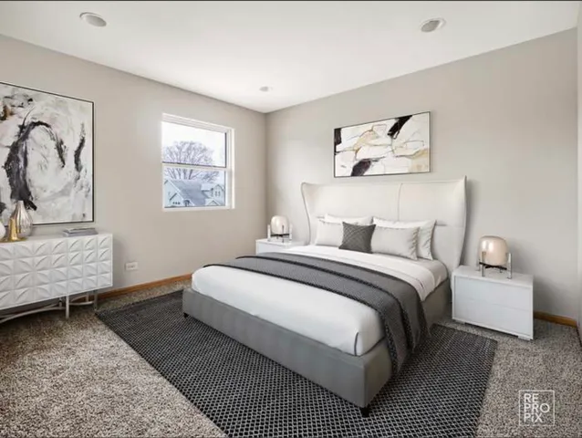 a bedroom with a bed and a couch