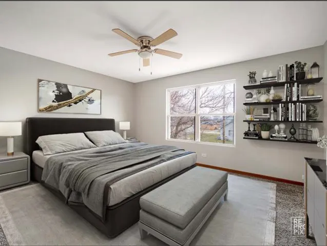 a bedroom with a large bed and a window