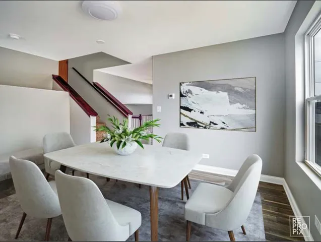 a view of a dining room with furniture and window
