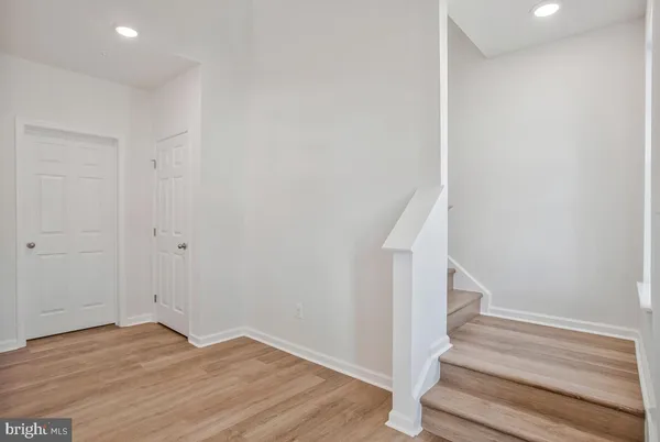 a view of entryway with wooden floor