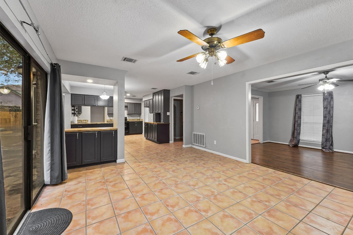3702 Ember Spring Drive Houston, TX 77339 - Photo 11 of 27 a view of an empty room with kitchen and a window