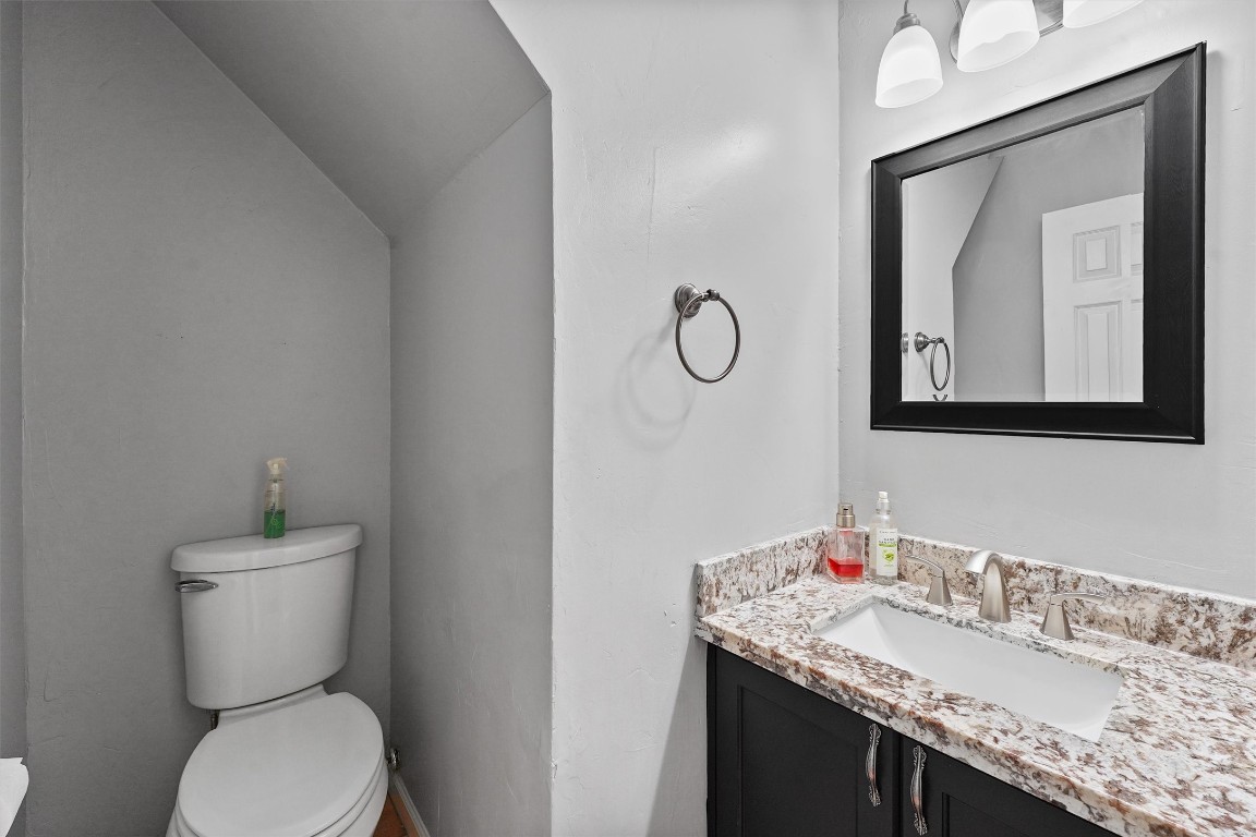 3702 Ember Spring Drive Houston, TX 77339 - Photo 14 of 27 a bathroom with a granite countertop toilet sink and mirror