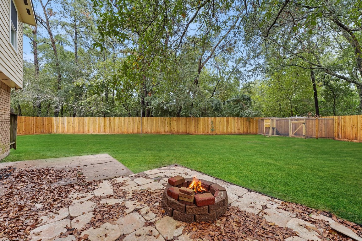 3702 Ember Spring Drive Houston, TX 77339 - Photo 25 of 27 a view of backyard with swimming pool and green space