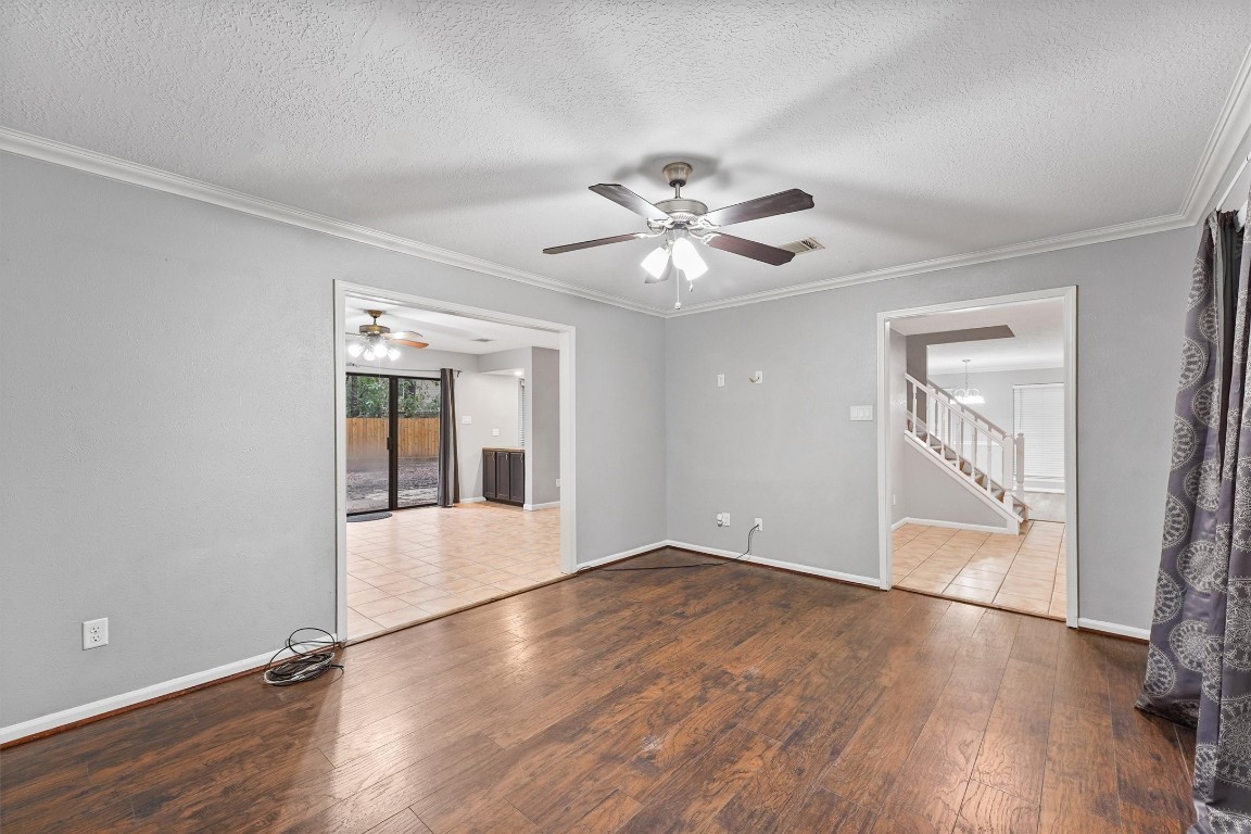 3702 Ember Spring Drive Houston, TX 77339 - Photo 10 of 27 an empty room with wooden floor and windows