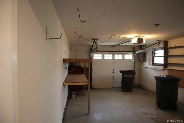 a room with furniture a window and flat screen tv