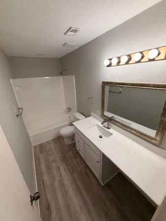 a bathroom with a sink and mirror