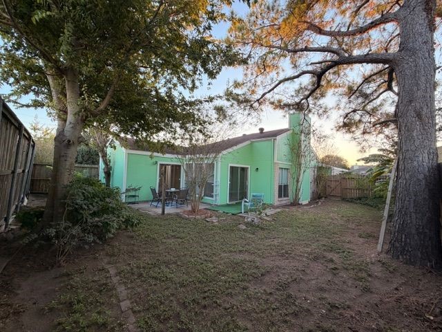 2955 Shadow Trail Drive Houston, TX 77082 - Photo 8 of 19 a view of a house with large trees and a barn