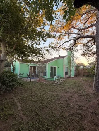 a house view with a backyard space